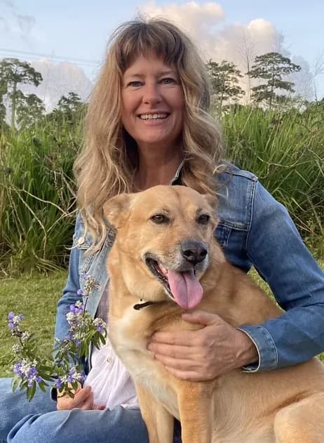 Lorraine, who founded Citrus Cleaning Services, at home with her dog at South Mission Beach