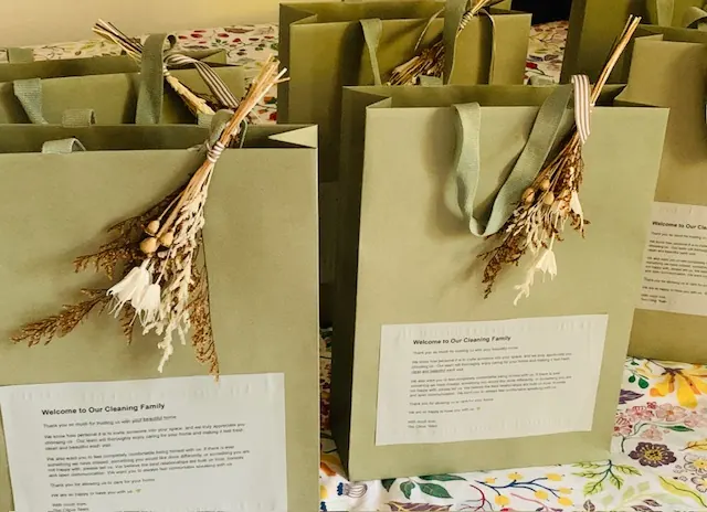 Citrus Cleaning Services client onboarding gift bags decorated with dried flowers