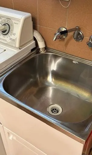 Laundry sink polished and shining after cleaning