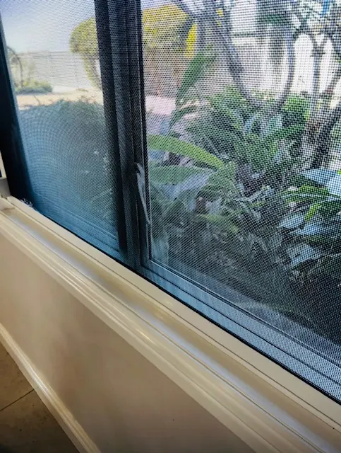 The same window sill and track scrubbed back to clean, bright white after cleaning